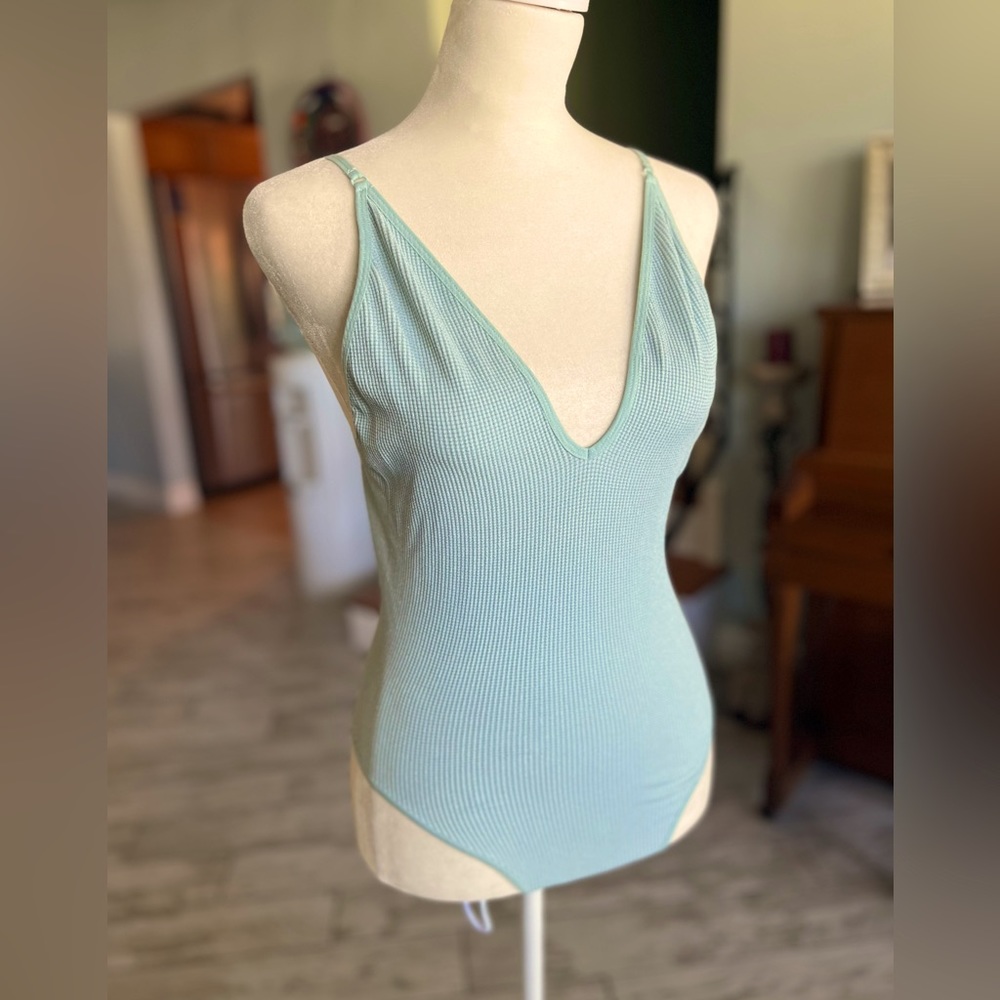 Shimmering baby blue bodysuit, so sexy with jeans and heels size medium